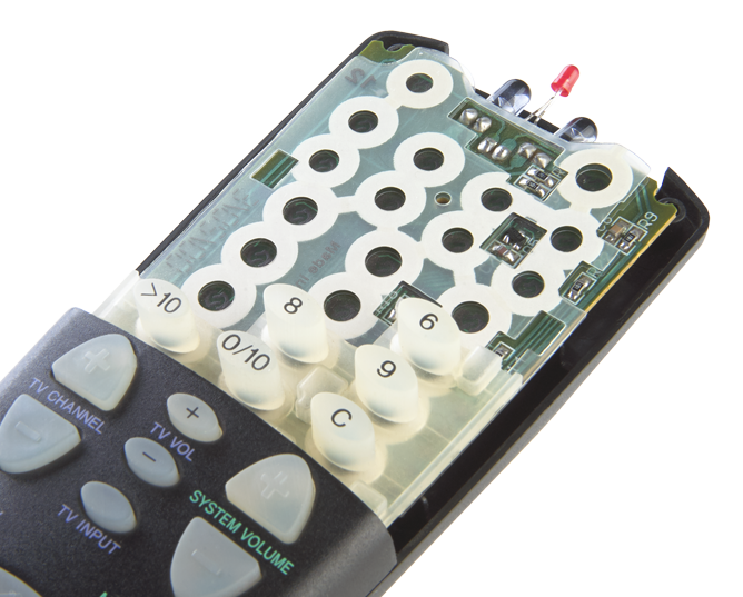 TV remote cutaway showing rubber keypad membrane and buttons attached to a circuit board TV remote cutaway showing rubber keypad membrane and buttons attached to a circuit board